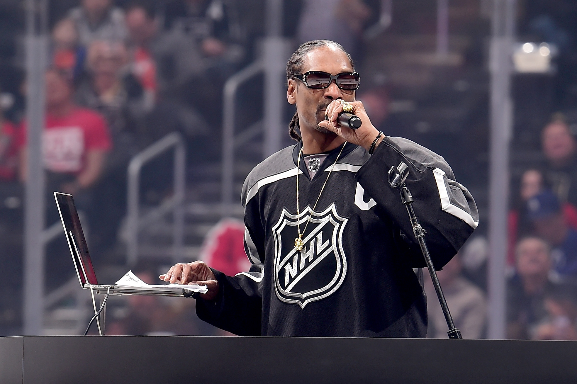 Snoop Dogg shows his hosting skills at the NHL All-Star Skills Competition on January 28, 2017 in Los Angeles, California.  (Photo by Harry How/Getty Images)