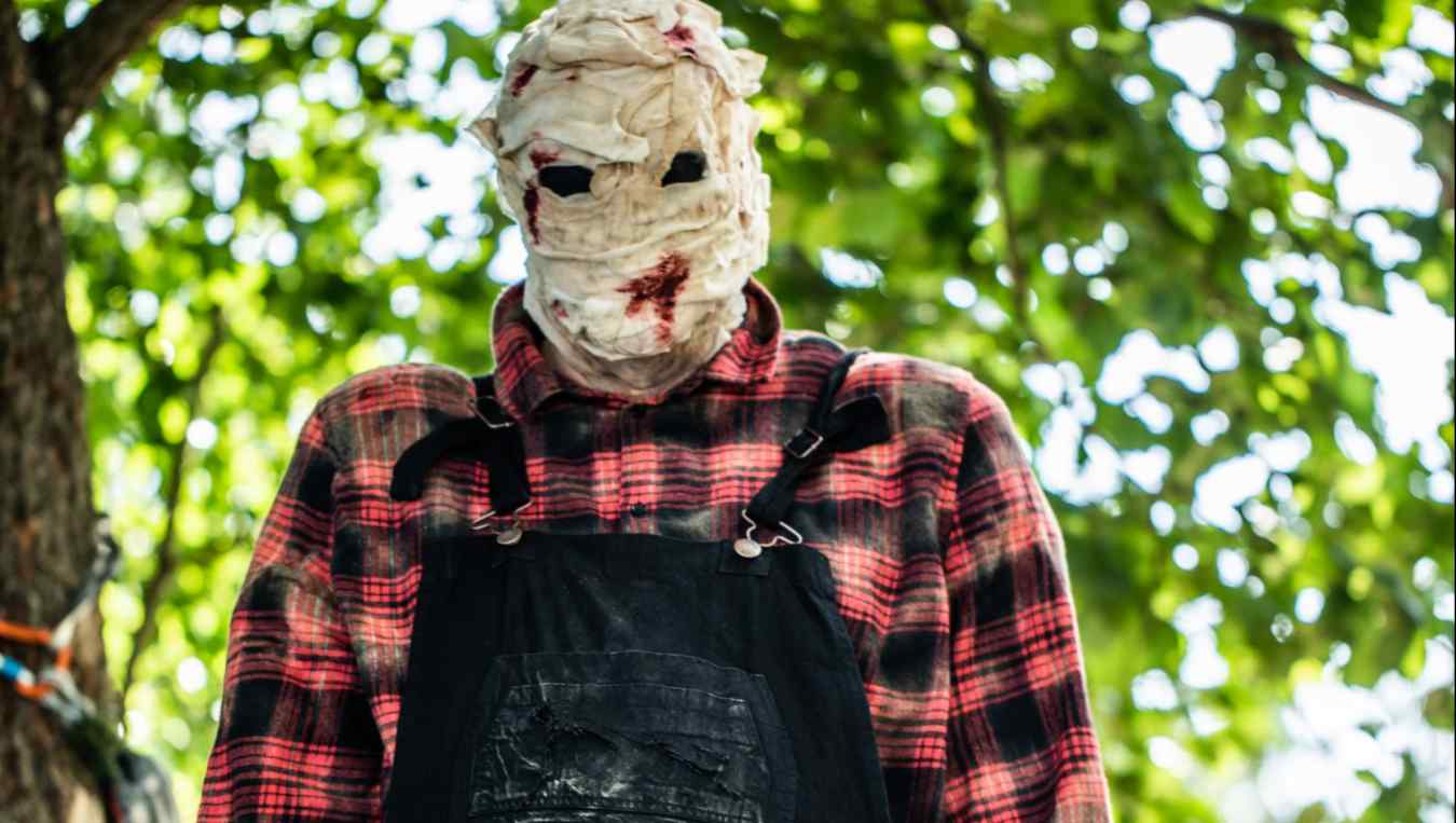 Bruce, the murderous handyman being controlled by the killer on The CW's Killer Camp