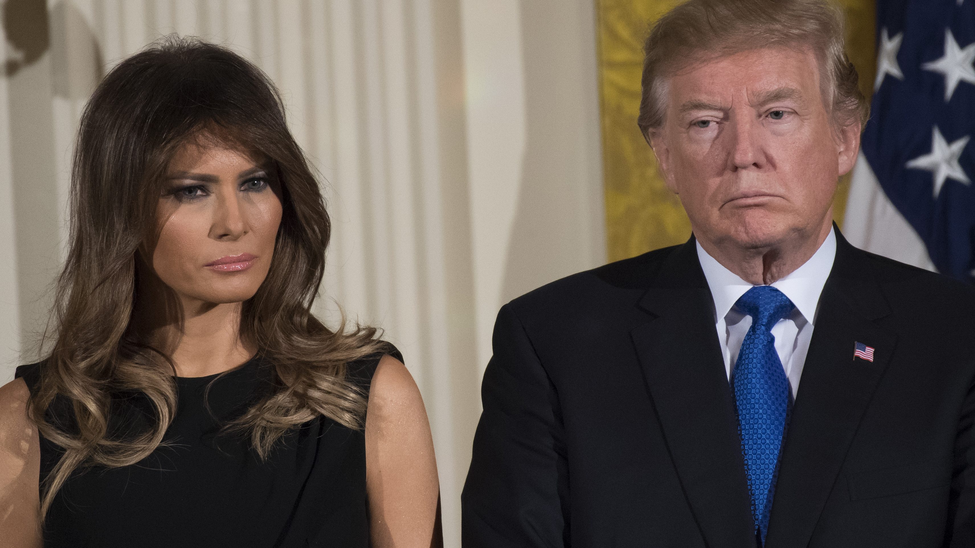 TOPSHOT - US President Donald Trump and First Lady Melania Trump attend a Hanukkah reception in the East Room of the White House