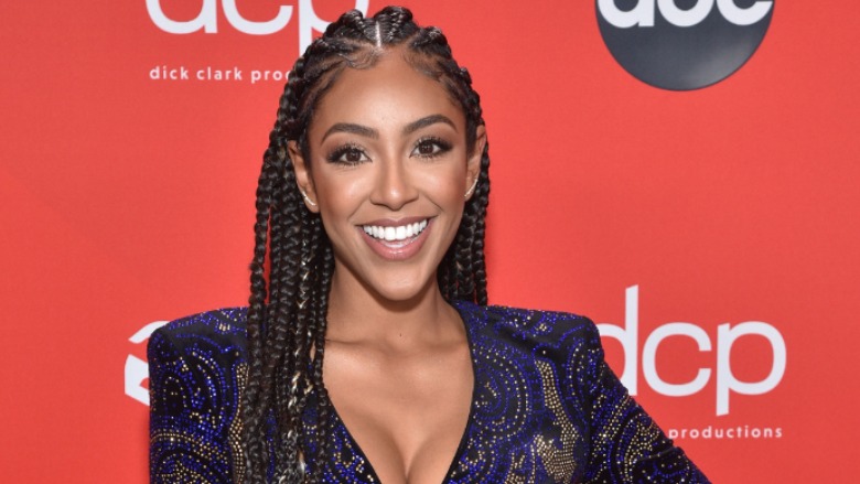 Tayshia Adams poses for a photo.