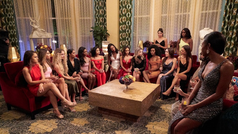 The cast of 'The Bachelor' sits on couches before the rose ceremony.