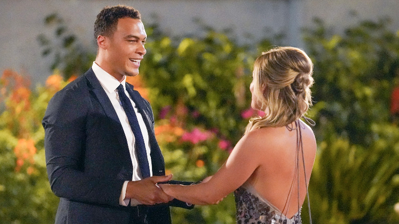 Dale Moss holds hands with Clare Crawley.