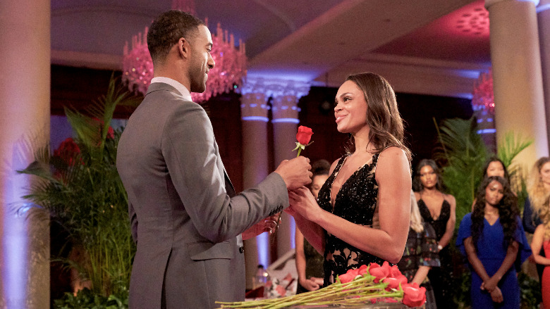 Matt James gives Michelle Young a rose.