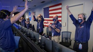 Members of NASA's Perseverance rover team react in mission control after receiving confirmation the spacecraft successfully touched down on Mars