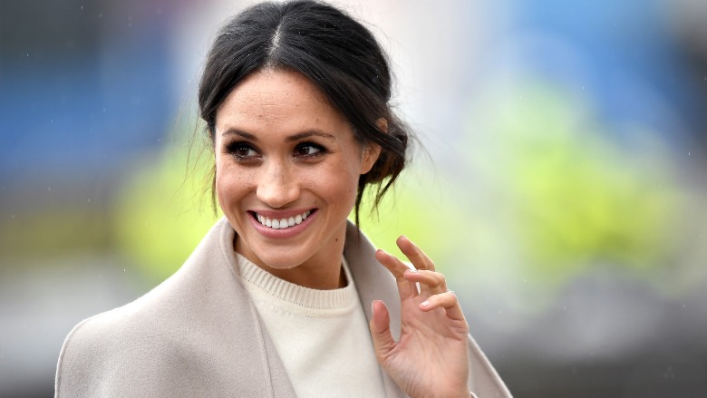 Meghan Markle in a beige coat..