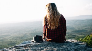 Blond woman on cliff