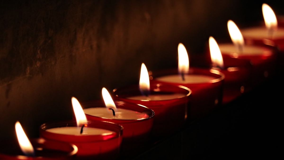 A row of lit tealights