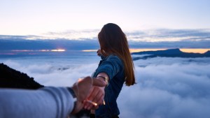 A man and woman holding hands.
