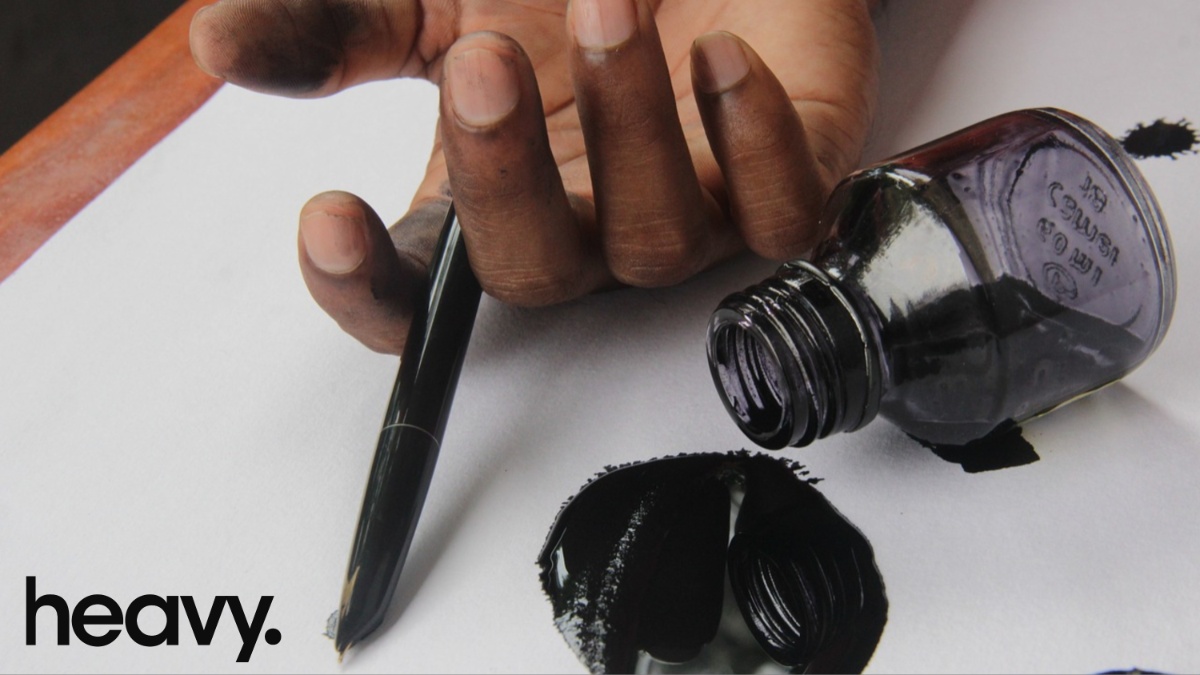 A man holding a pen.