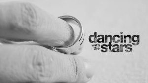 A man holding his wedding ring.