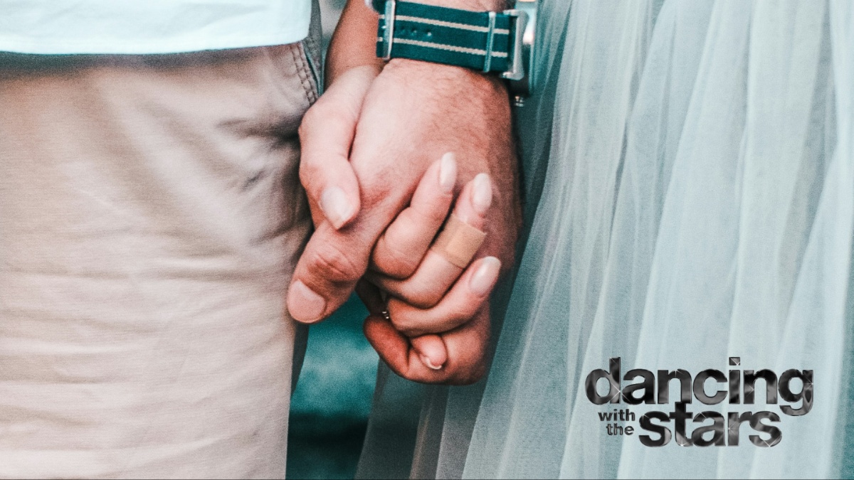 A couple holding hands.