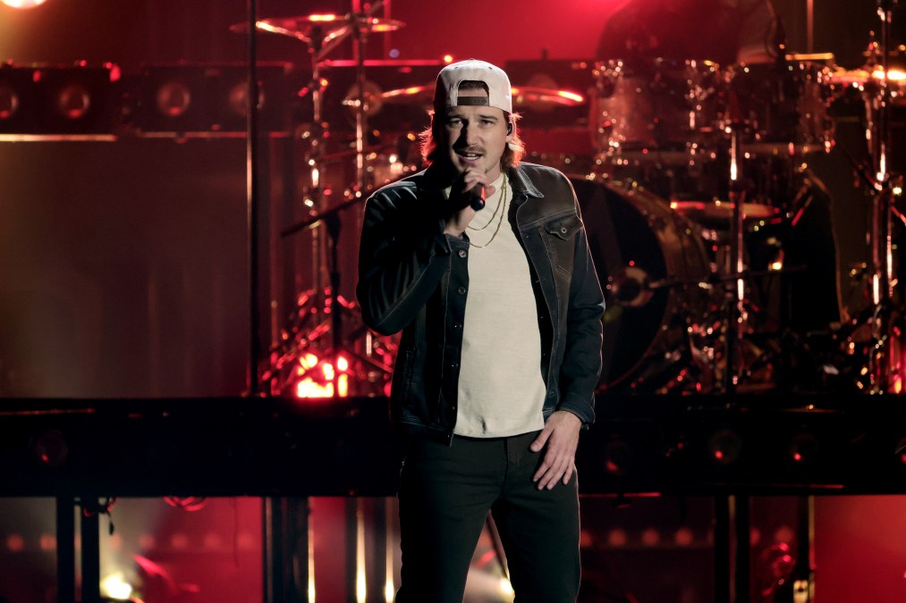 Morgan Wallen singing into a microphone