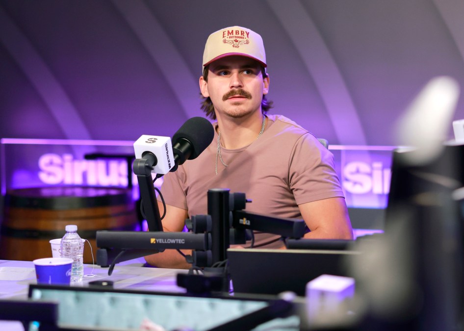 Tucker Wetmore sits behind a microphone