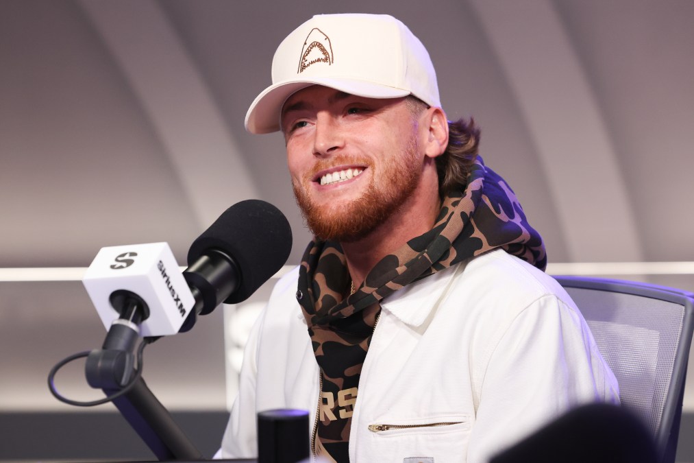 Bailey Zimmerman smiling behind a microphone