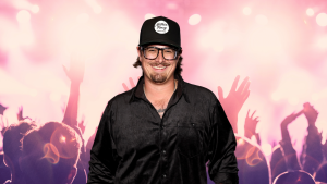 HARDY wearing a black shirt and smiling