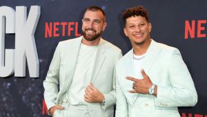 Travis Kelce and Patrick Mahomes pose on the red carpet
