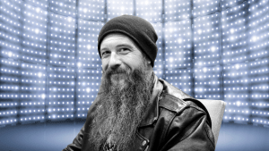 Cody Jinks smiles in a chair