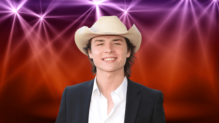 John Foster posing in a cowboy hat