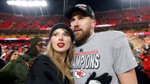 Taylor Swift celebrates with Travis Kelce #87 of the Kansas City Chiefs after defeating the Buffalo Bills 32-29 in the AFC Championship Game at GEHA Field at Arrowhead Stadium on January 26, 2025 in Kansas City, Missouri