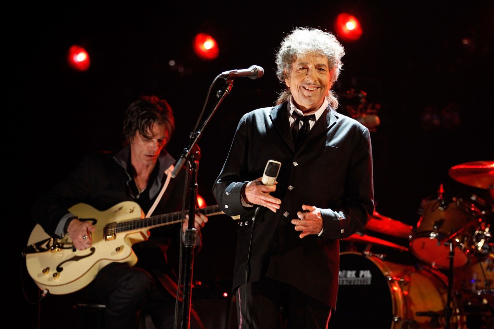 Bob Dylan smiling on stage