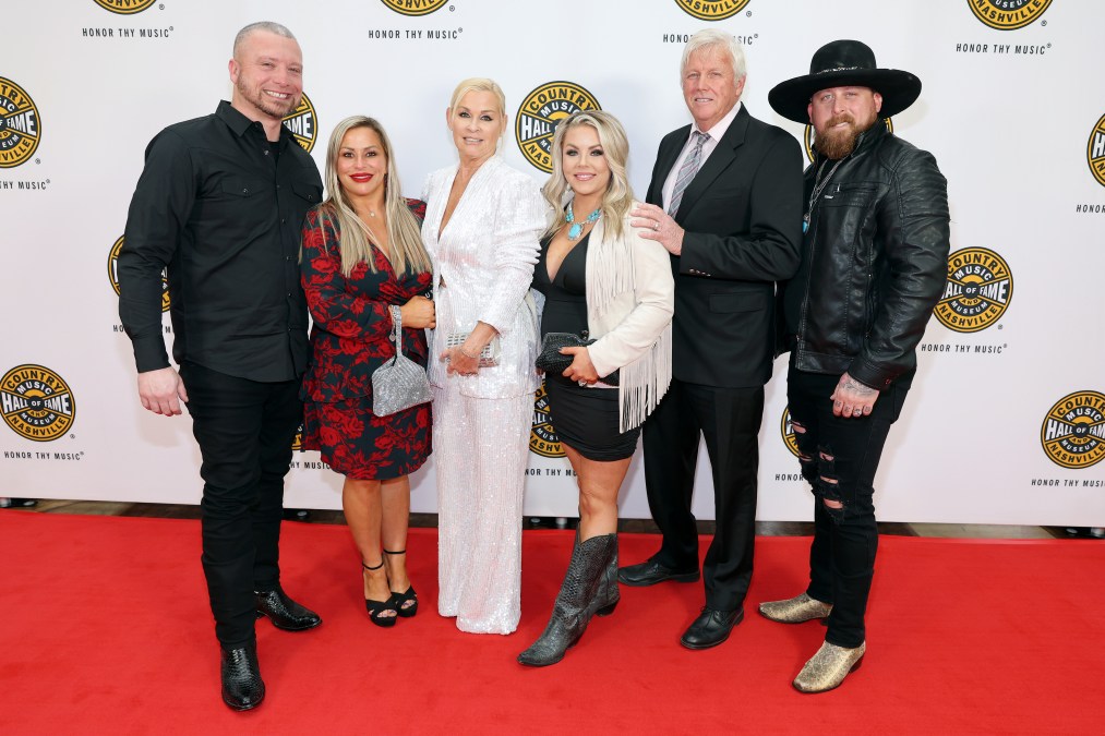 Jesse Keith Whitley, Lorrie Morgan, and other family members posing at an event