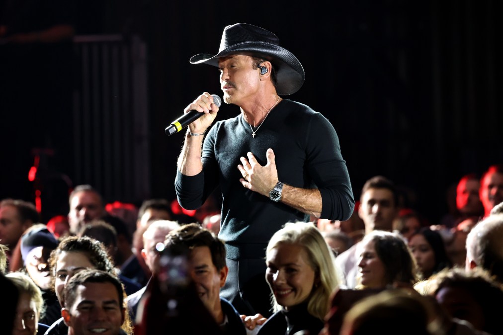 Tim McGraw singing in the middle of a crowd