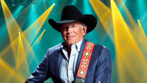 George Strait posing on stage.