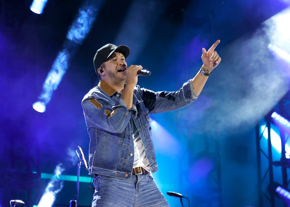 Luke Bryan singing on stage