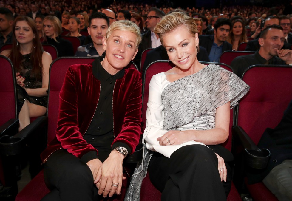 Ellen DeGeneres and Portia de Rossi posing together.