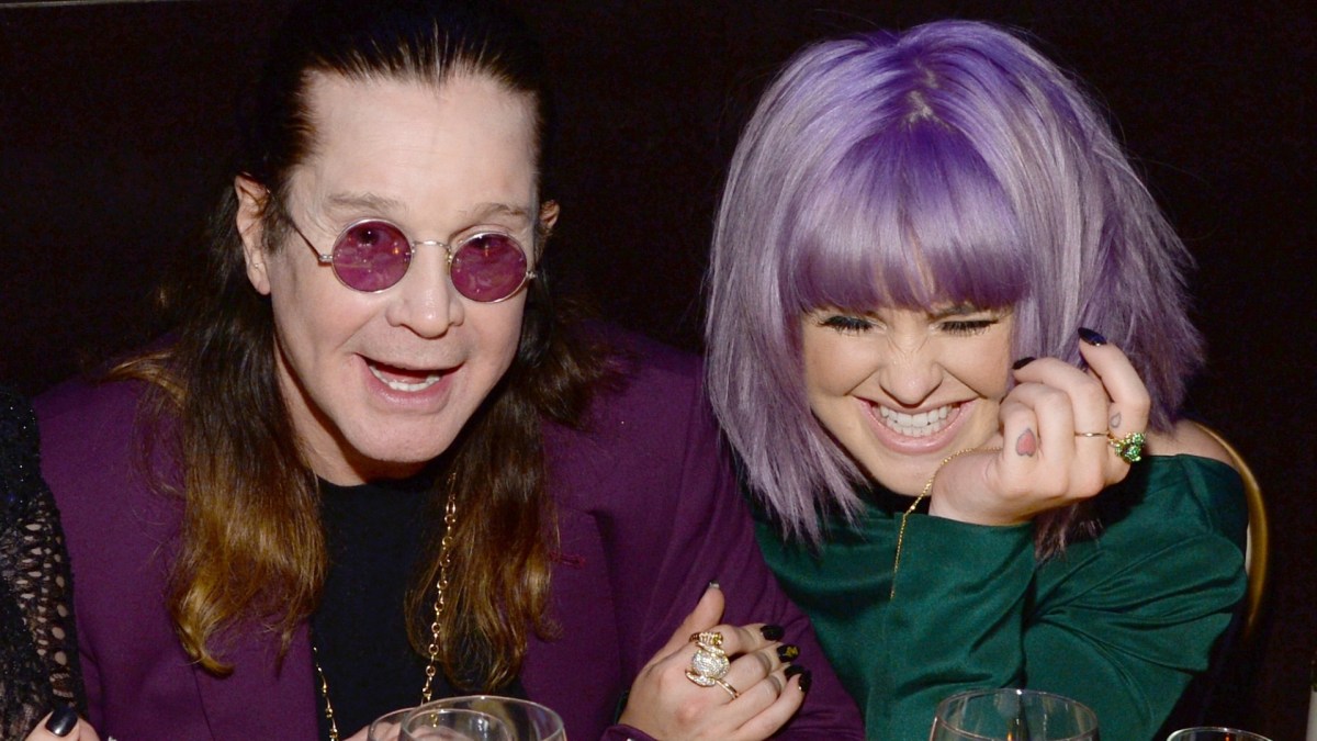 Kelly Osbourne laughing with father Ozzy Osbourne