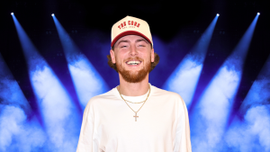Bailey Zimmerman smiles in a white hat and t-shirt.