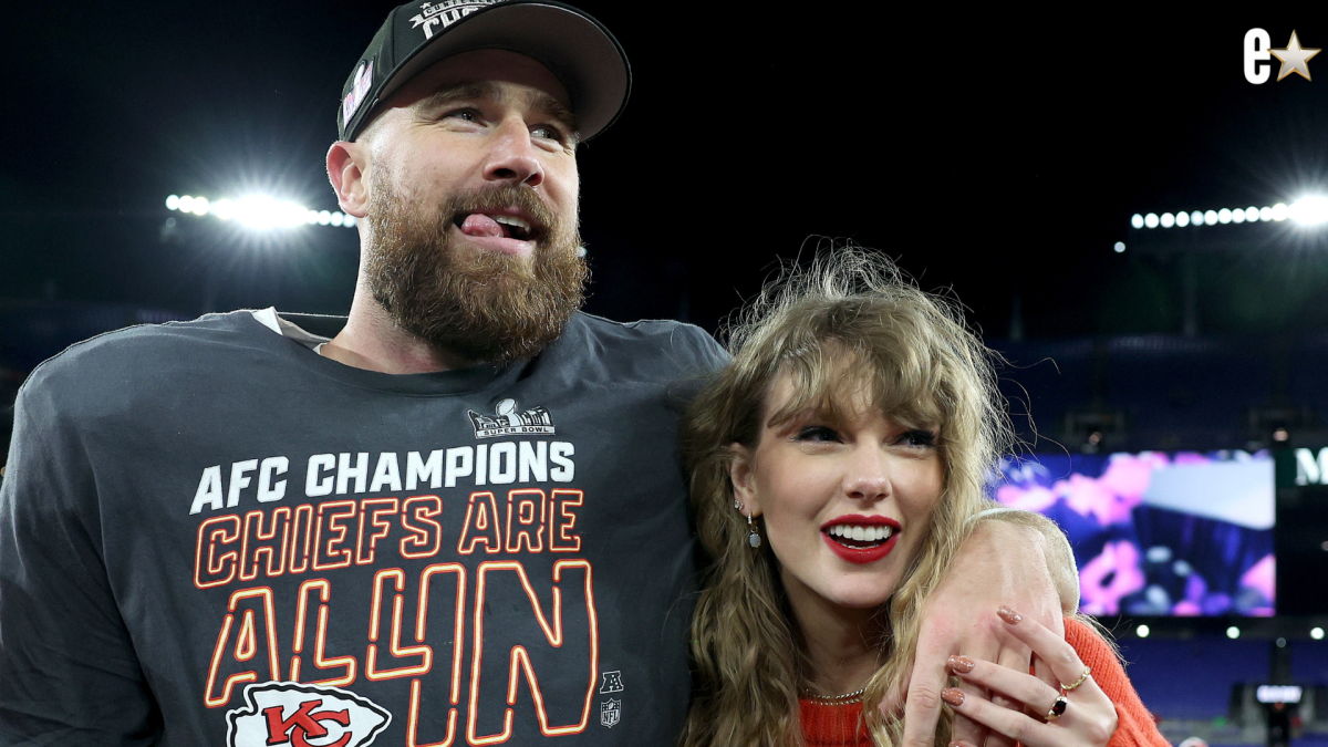 Travis Kelce #87 of the Kansas City Chiefs celebrates with Taylor Swif