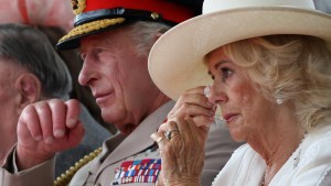 Britain's King Charles and Queen Camilla wipes away tears