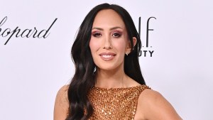 Cheryl Burke smiling at an event