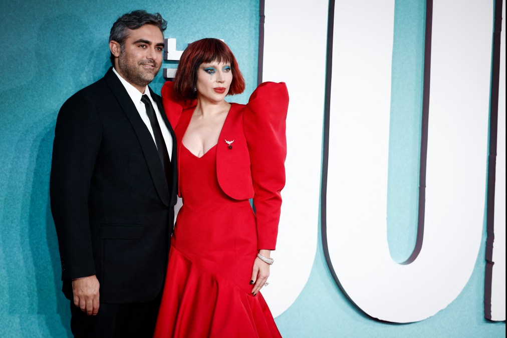 US singer-songwriter and actor Lady Gaga poses on the red carpet with her Fiance Michael Polansky