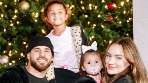 Cory Wharton smiles and poses for photos with his family