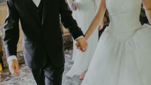 A bride and groom holding hands