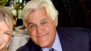 Jay Leno poses for a photo, smiling