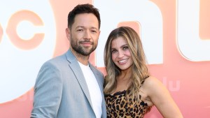 Pasha Pashkov and Danielle Fishel smiling at an event