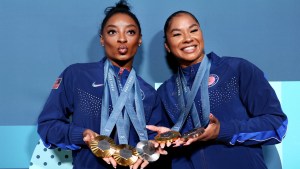 Simone Biles and Jordan Chiles pose with their medals