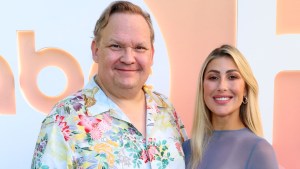 Andy Richter and Emma Slater pose for photo at event