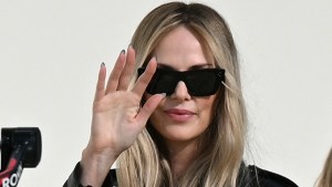 Charlize Theron waving