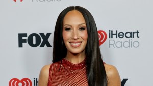 Cheryl Burke smiling for photos at an event