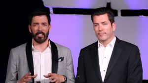 Drew Scott and Jonathan Scott speaking at an event