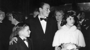 Frank Sinatra with his son and daughter at an event