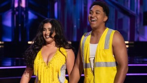 Lauren Jauregui and Brandon Armstrong smiling onstage