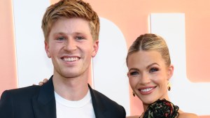 Robert Irwin and Witney Carson smiling at an event