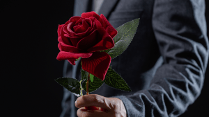 man holding a rose