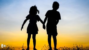 Brother and sister holding hands