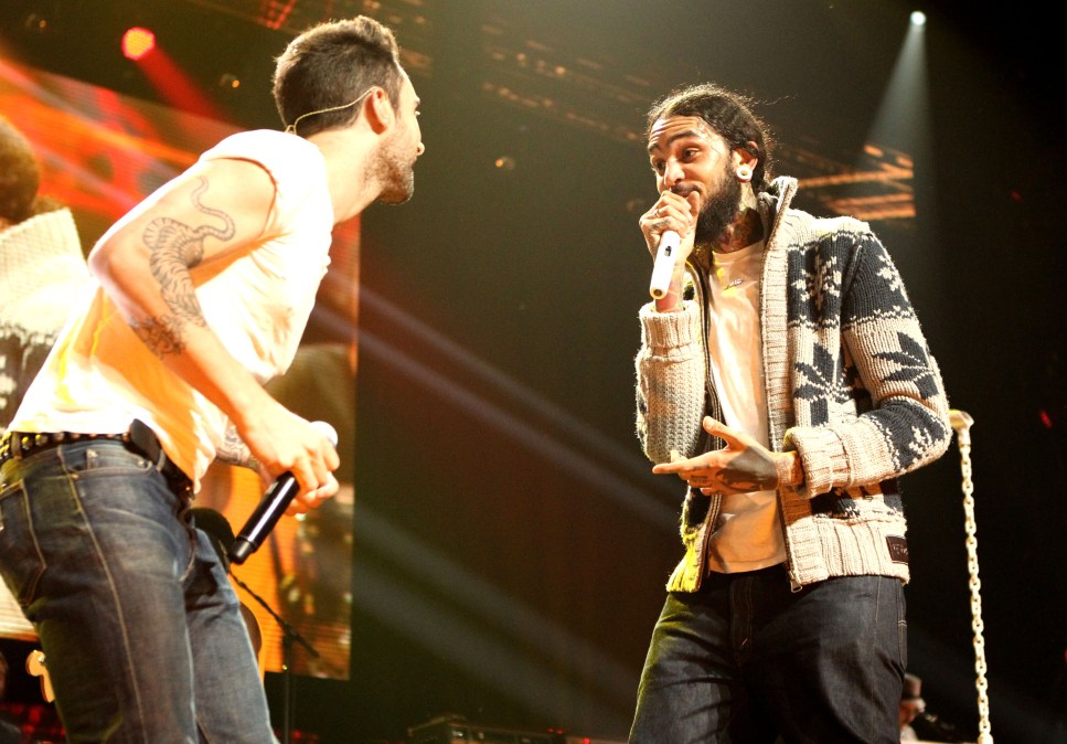 Singer Adam Levine and Singer Travie McCoy 